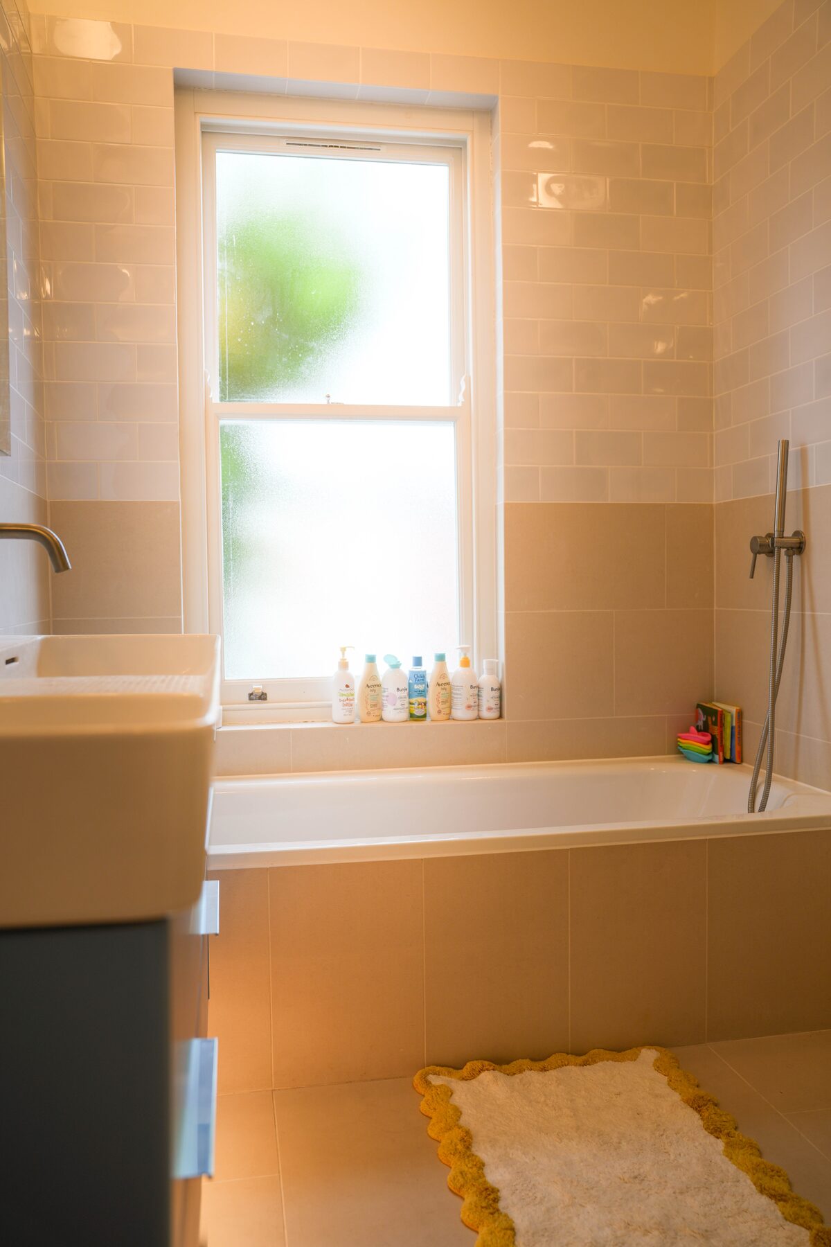 Bathroom with metro tiles and sash window